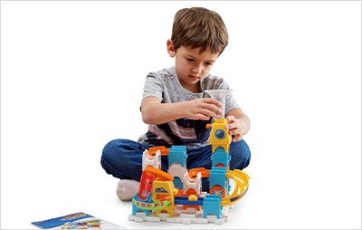 Child building the Marble Rush Discovery Starter Set.