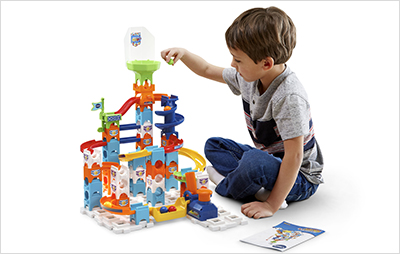 Child building the Marble Rush Spiral Starter Set.